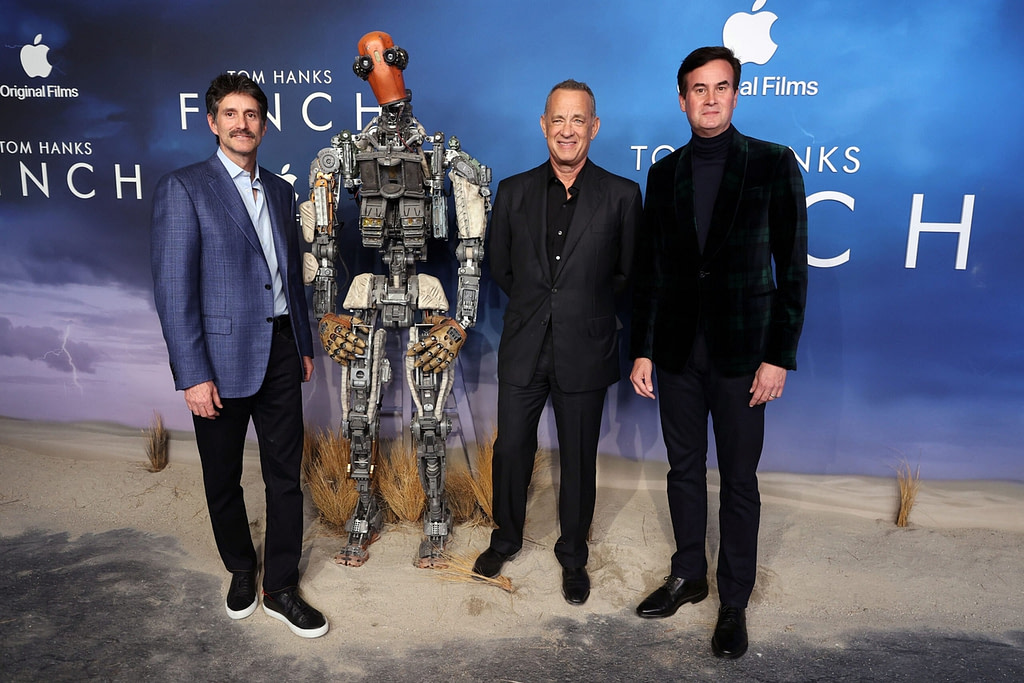 LOS ANGELES, CA - NOVEMBER 2: Zack Van Amburg - Apple's Head of Worldwide Video, Tom Hanks and Jamie Erlicht - Apple's Head of Worldwide Video attend Apple's Finch premiere screening at The Pacific Design Center. Finch will premiere globally on Apple TV+ on November 5, 2021